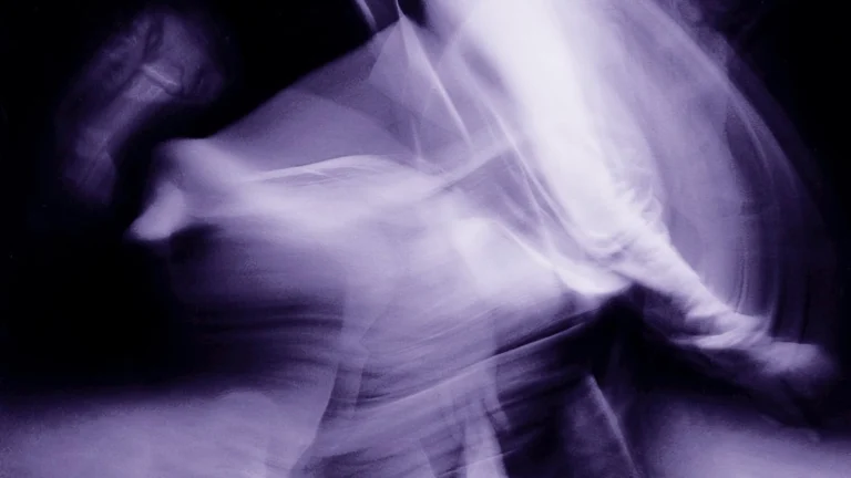 Blurred long-exposure image of a dancer in motion