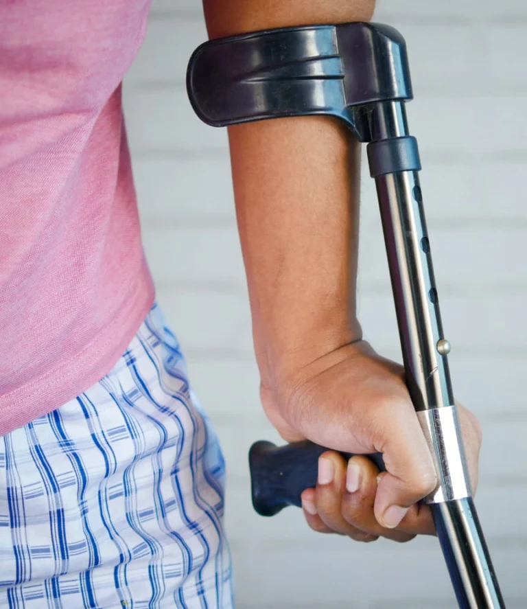 Hand holding a forearm crutch