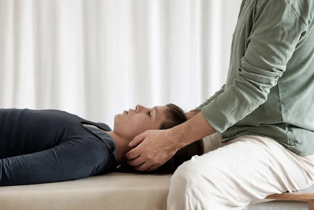 A one-to-one Feldenkrais session on a treatment table